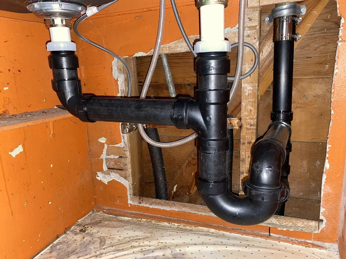 Professional Garbage Disposal Repair equipment and tools on the job in Suncrest